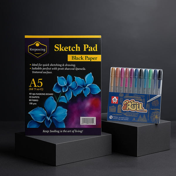 Sketch pad and colored markers on black stands against a dark background