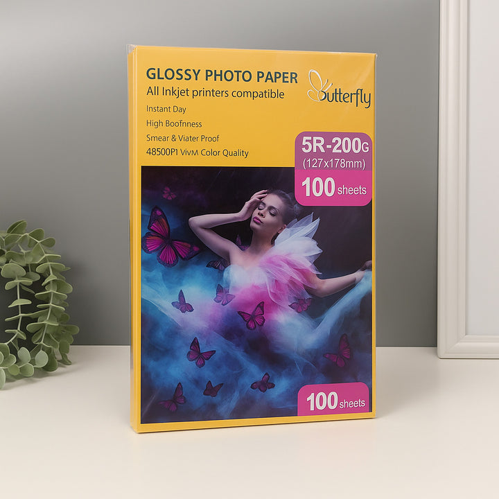 Butterfly Glossy Photo Paper packaging with a woman and butterflies on a gray background