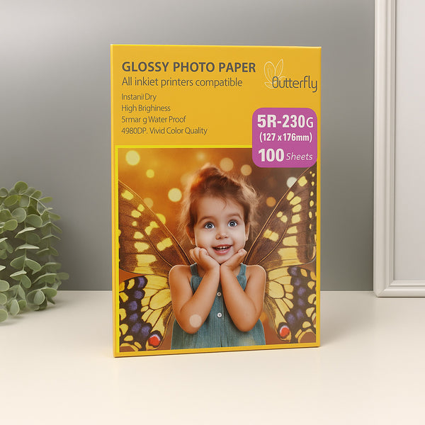Box of Glossy Photo Paper with a child and butterfly design on a neutral background