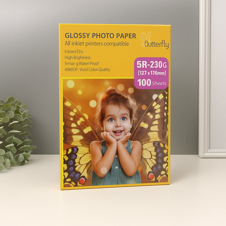 Box of Glossy Photo Paper with a child and butterfly design on a neutral background