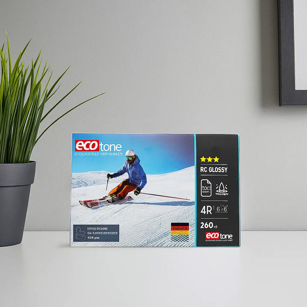 Packaging of eco-tone photo paper with a skier on a snowy landscape