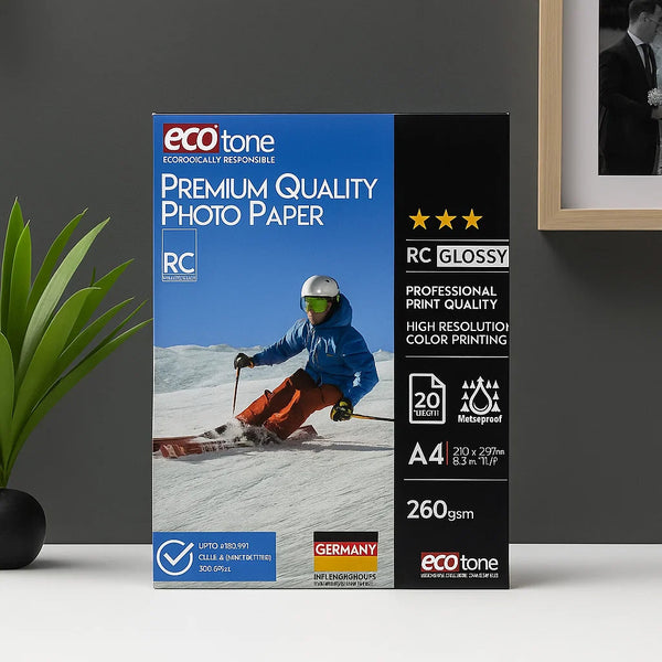 Box of eco-tone premium quality photo paper with a skier on a mountain background