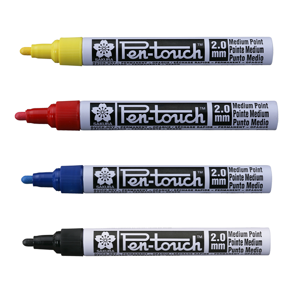 Four Sakura Pen-touch markers in yellow, red, blue, and black on a white background.