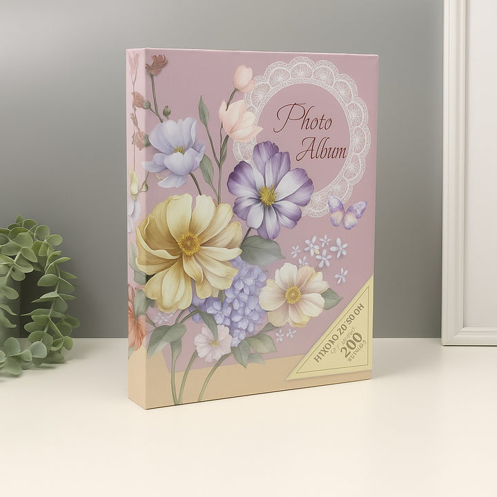 Floral photo album with decorative cover on a neutral background
