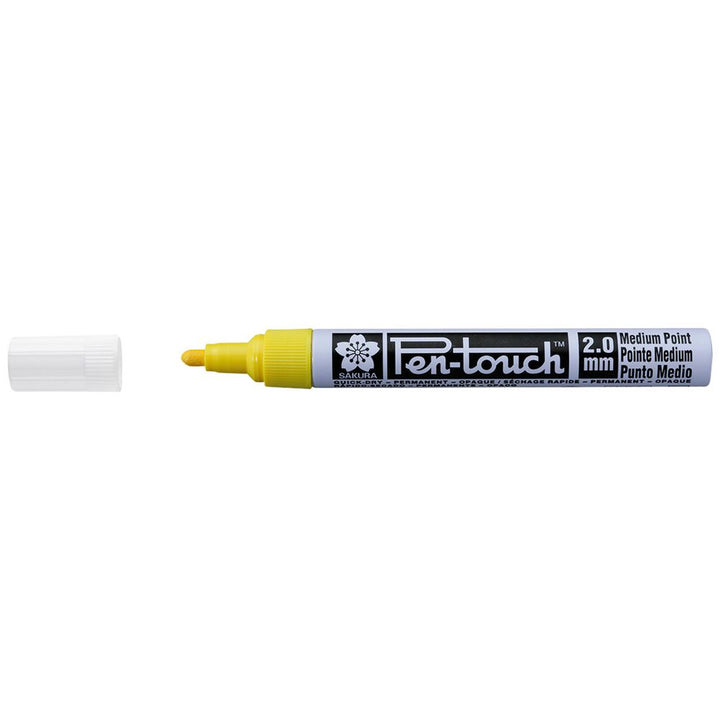 Pen-touch marker with yellow cap on a white background