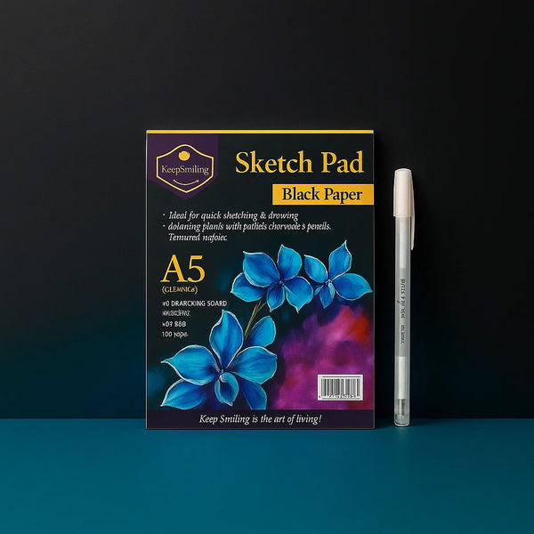 Sketch pad with black paper and a pen on a dark background