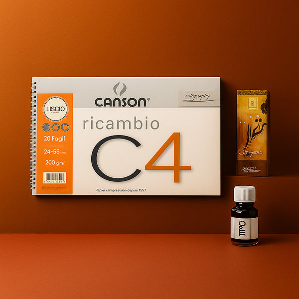 Canson Liscio calligraphy set with ink bottle on an orange background