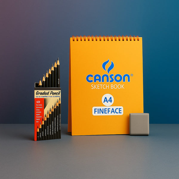 Canson sketch book and graded pencils on a gray surface with a blue gradient background